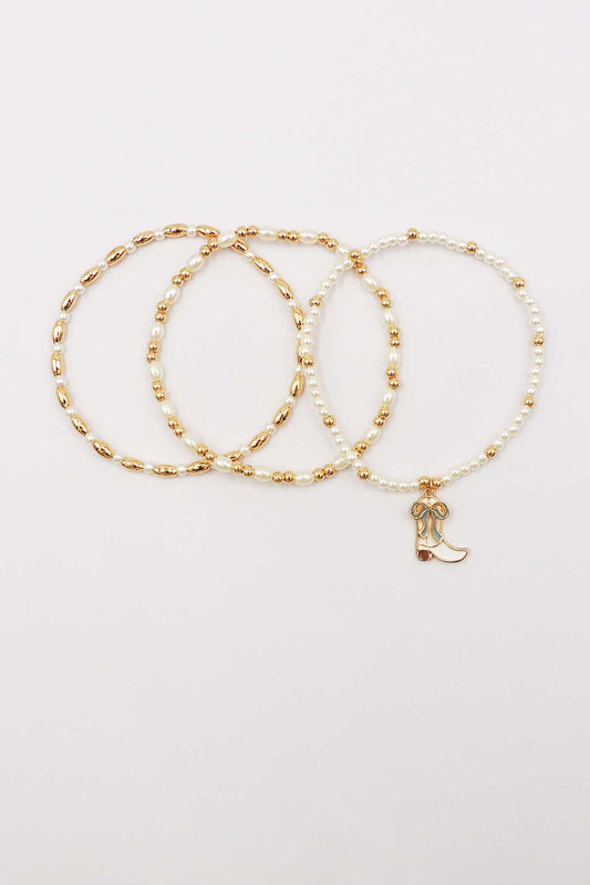 Set of Three Gold and Pearl Stretch Bracelets with Light Blue Bow on White Cowboy Boot Charm