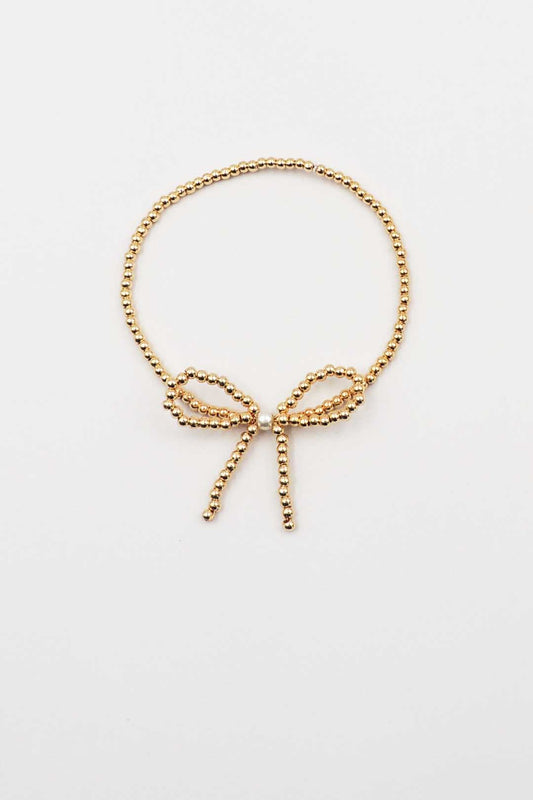 Gold Beaded Stretch Bracelet with Gold Beaded Bow and Pearl Accent