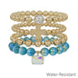 Water Resistant Set of 4 Cross and Blue Crystal Beaded Stretch Bracelets